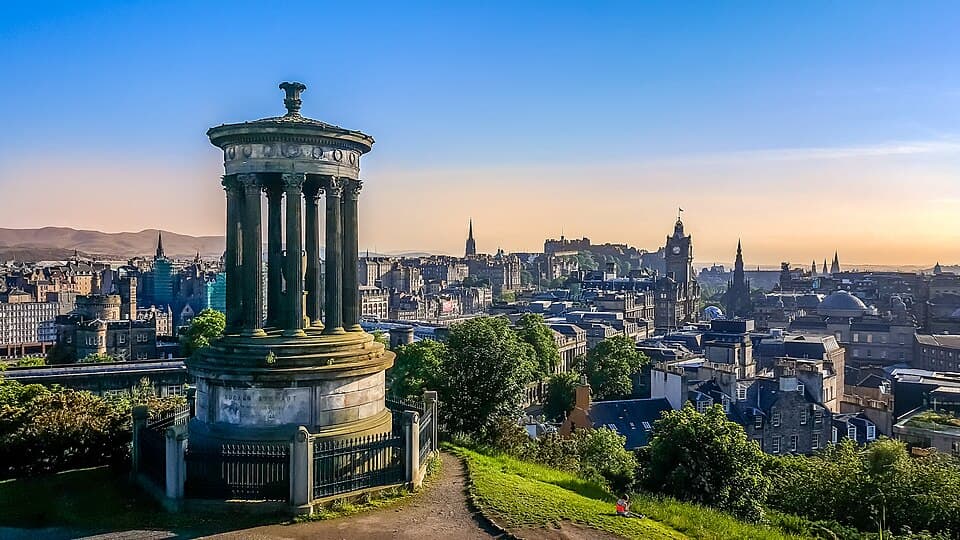 Dugald Stewart Monument on Calton Hill overlooking the Edinburgh skyline