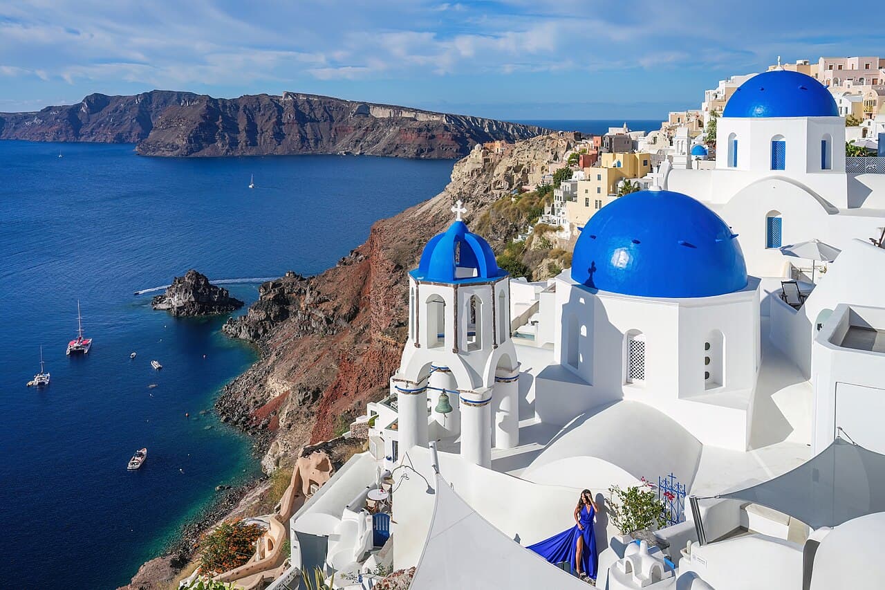 Blue-domed churches above the caldera in Oia, Santorini