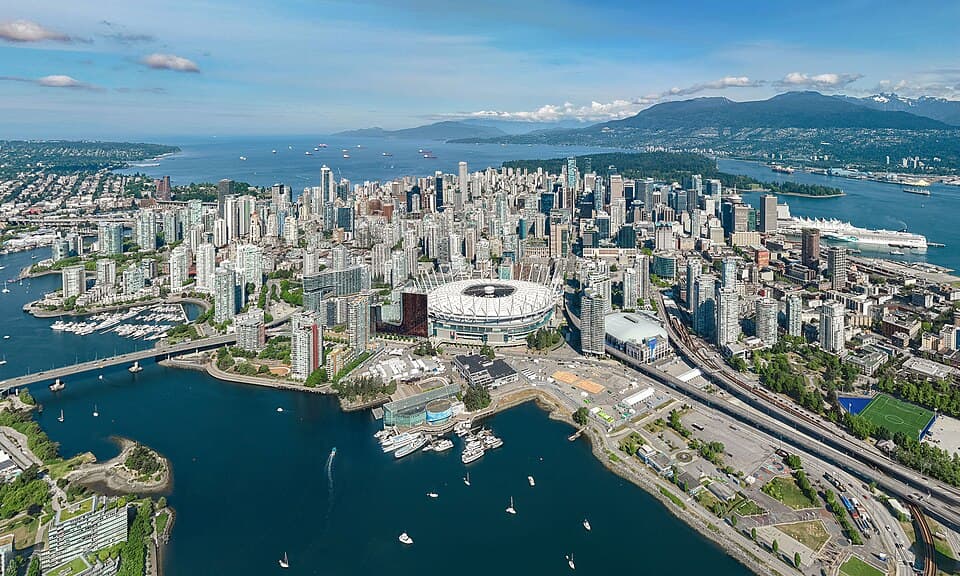 Aerial view of downtown Vancouver, False Creek and the surrounding mountains