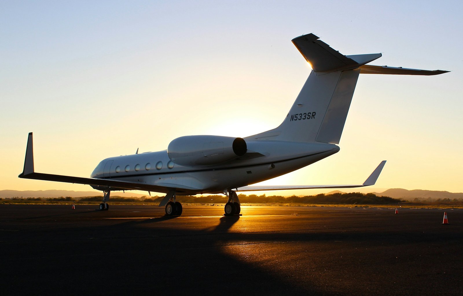 Private aircraft on the apron in warm evening light